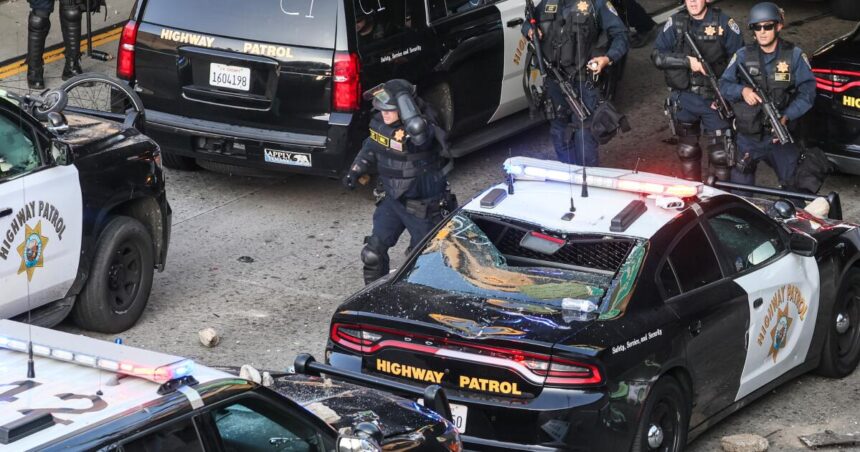 Feds charge 12 in alleged violence, attacks on police during immigration protests