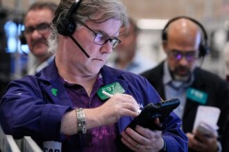 Wall Street rallies to more records as gold's price slumps again